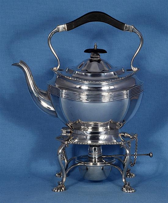 A silver kettle on stand, Height 11 ½”/290mm Width: 9”/230mm Weight 42.8oz/1213g.